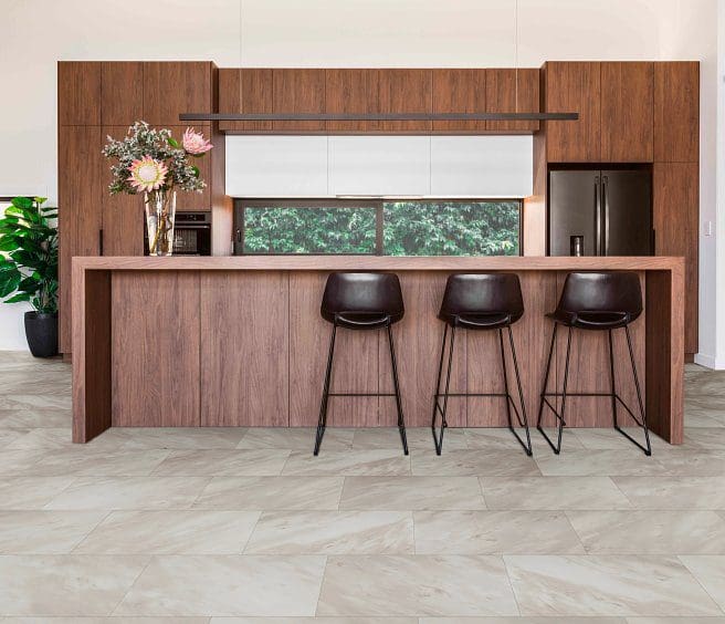 Modern kitchen island with three stools.